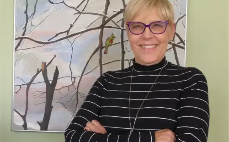 Linda evans a smiling middle aged white woman